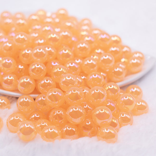 front view of a pile of 12mm Orange Jelly AB Acrylic Bubblegum Beads - 20 Count