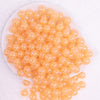 top view of a pile of 12mm Orange Jelly AB Acrylic Bubblegum Beads - 20 Count
