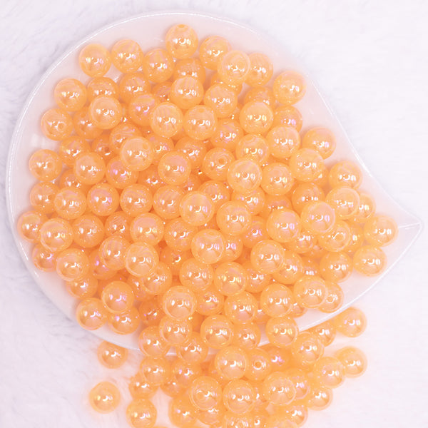 top view of a pile of 12mm Orange Jelly AB Acrylic Bubblegum Beads - 20 Count