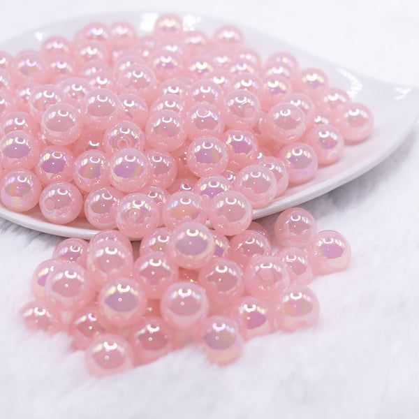 front view of a pile of 12mm Pink Jelly AB Acrylic Bubblegum Beads - 20 Count