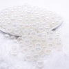 front view of a pile of 12mm White Jelly AB Acrylic Bubblegum Beads - 20 Count