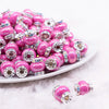 front view of a pile of 15mm Hot Pink Spacer Bead with Rhinestone Rondelle - 5 Count per order