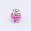 top view of a pile of 15mm Hot Pink Spacer Bead with Rhinestone Rondelle - 5 Count per order