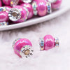 macro view of a pile of 15mm Hot Pink Spacer Bead with Rhinestone Rondelle - 5 Count per order