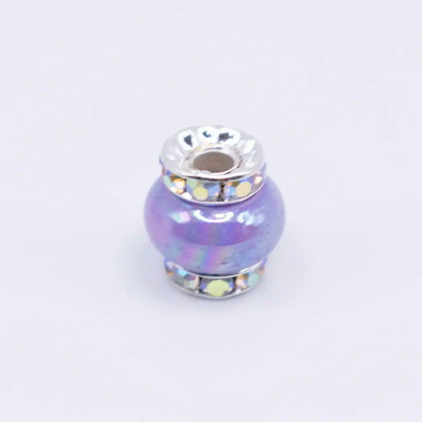 top view of a pile of 15mm Light Purple Spacer Bead with Rhinestone Rondelle - 5 Count per order