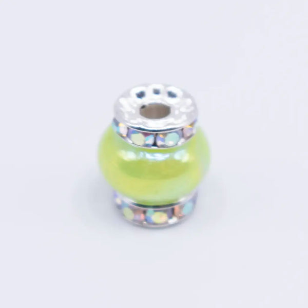 top view of a pile of 15mm Lime Green Spacer Bead with Rhinestone Rondelle - 5 Count per order