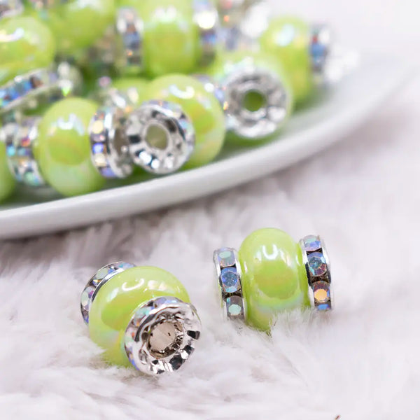 macro view of a pile of 15mm Lime Green Spacer Bead with Rhinestone Rondelle - 5 Count per order