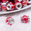 macro view of a a pile of 15mm Red Spacer Bead with Rhinestone Rondelle - 5 Count per order