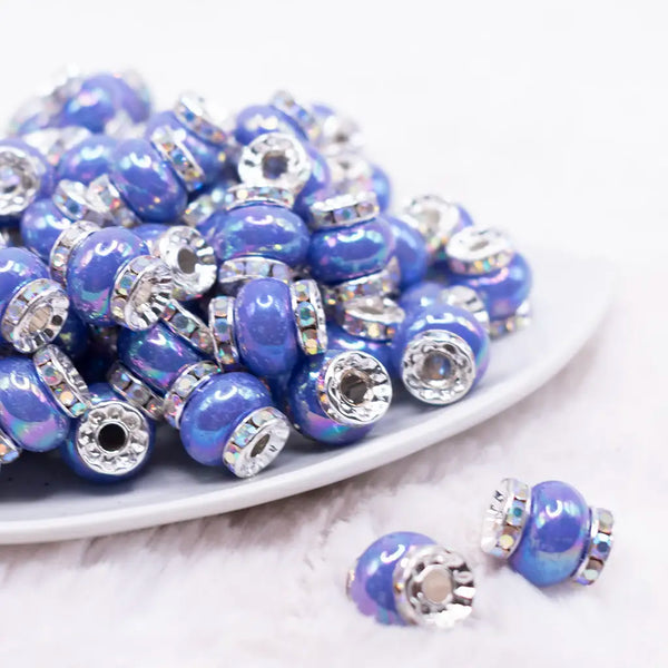 front view of a pile of 15mm Royal Blue Spacer Bead with Rhinestone Rondelle - 5 Count per order