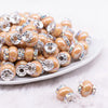 front view of a pile of 15mm Sand Spacer Bead with Rhinestone Rondelle - 5 Count per order