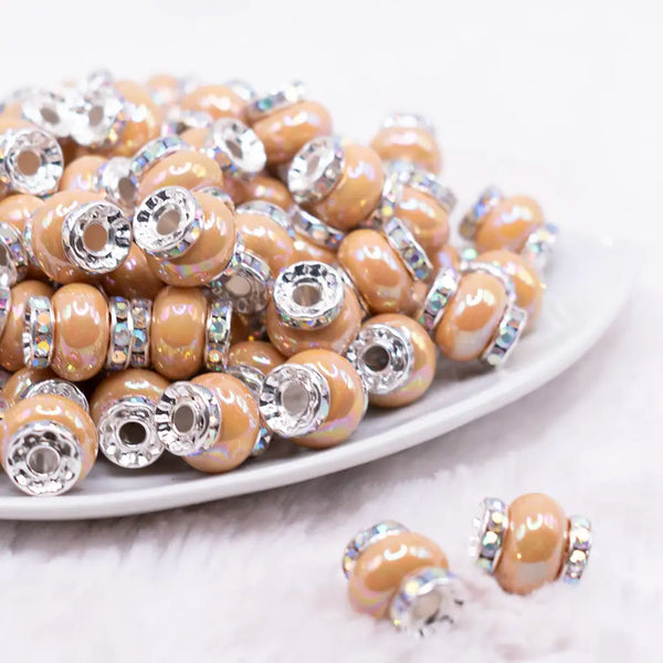 front view of a pile of 15mm Sand Spacer Bead with Rhinestone Rondelle - 5 Count per order