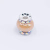 top view of a pile of 15mm Sand Spacer Bead with Rhinestone Rondelle - 5 Count per order