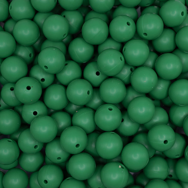 top view of a pile of 15mm Christmas Green Round Silicone Bead