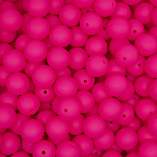 top view of a pile of 15mm Hot Pink Round Silicone Bead