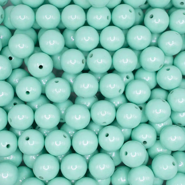 top view of a pile of 15mm Mint Green Opal Shimmer Round Silicone Bead
