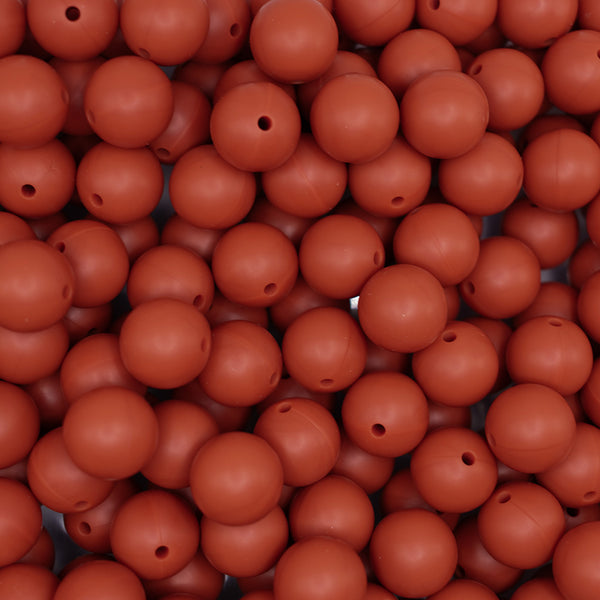 top view of a pile of 15mm Red/Brown Round Silicone Bead