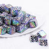 frontview of a pile of 15mm Black Cow with AB finish luxury square acrylic beads