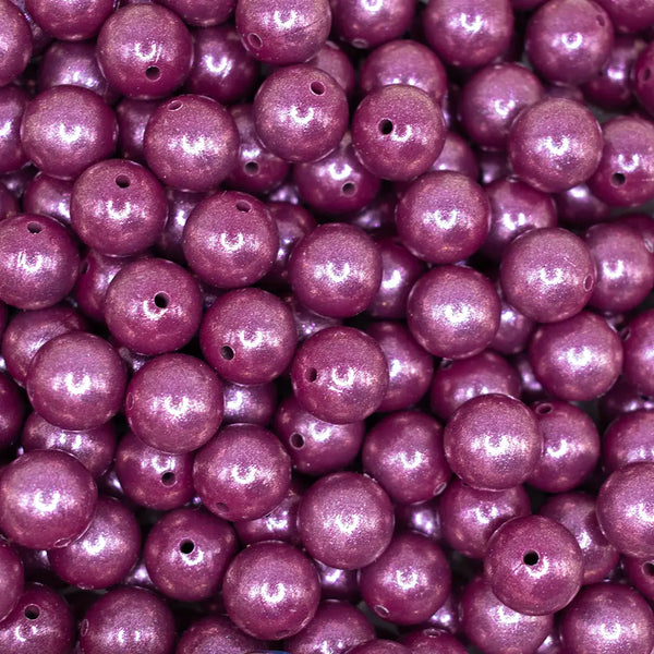 top view of a pile of 15mm Wine Purple Opal Shimmer Round Silicone Bead