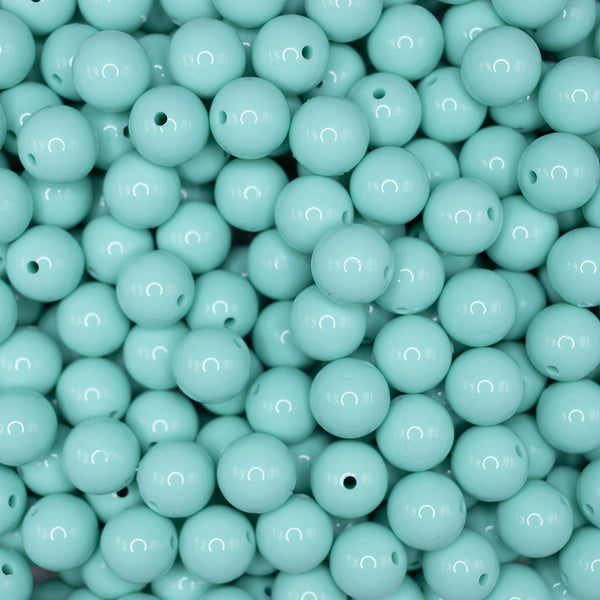 front view of a pile of 15mm Aqua Green Liquid Style Silicone Bead