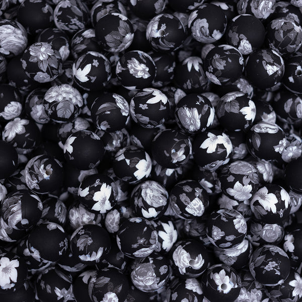 top view of a pile of 15mm Black/Gray Floral Print Silicone Bead