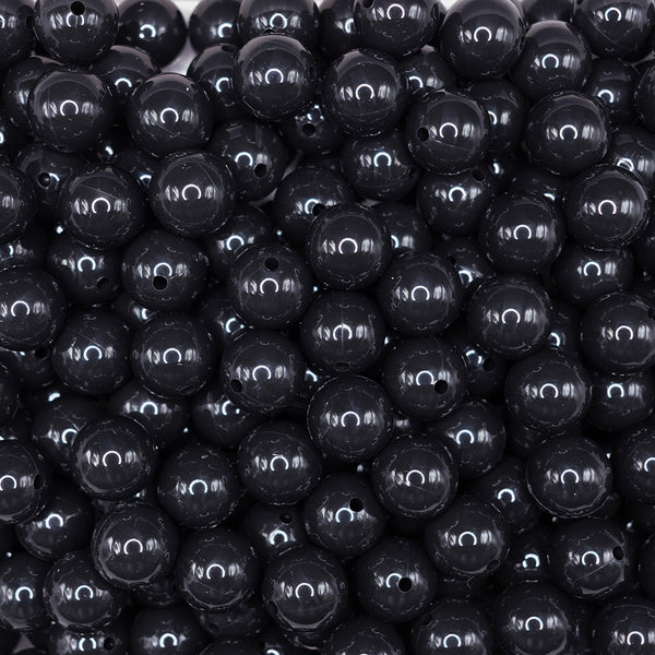 front view of a pile of 15mm Black Liquid Style Silicone Bead