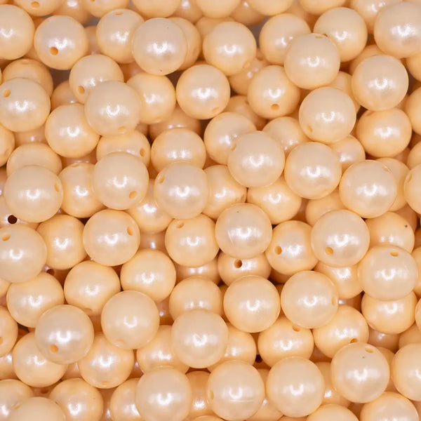top view of a pile of 15mm Blonde Yellow Opal Shimmer Round Silicone Bead