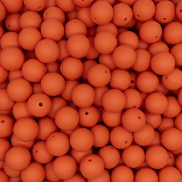 close up view of a pile of 15mm Carrot Orange Round Silicone Bead