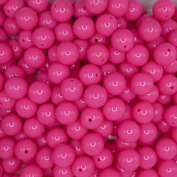 top view of a pile of 15mm Hot Pink Liquid Style Silicone Bead