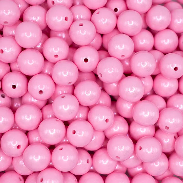 top view of a pile of 15mm Light Pink Opal Shimmer Round Silicone Bead
