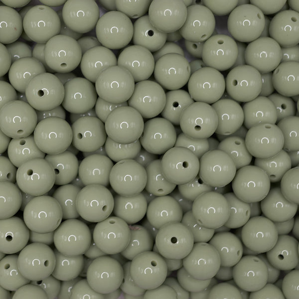 front view of a pile of 15mm Matcha Green Liquid Style Silicone Bead