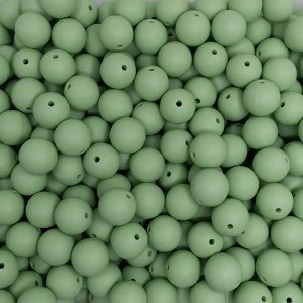 close up view of a pile of 15mm Nature Green Round Silicone Bead