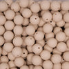 top view of a pile of 15mm Navajo White Embossed Floral Print Silicone Bead