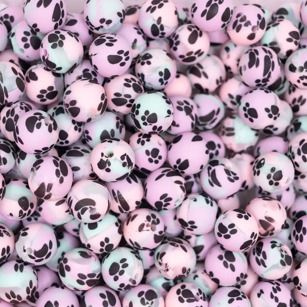 top view of a pile of 15mm Pastel Ombre Paw Print Silicone Bead