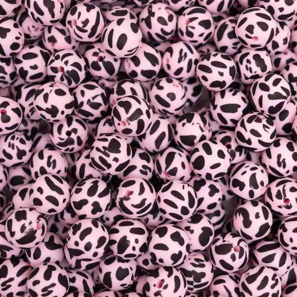 top view of a pile of 15mm Pink and Black Cow Print Silicone Bead