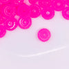 top view of a pile of 12mm Pink Glow In the Dark Resin Rondelle Spacer Beads - Set of 20