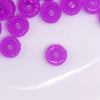 top view of a pile of 12mm Purple Glow In the Dark Resin Rondelle Spacer Beads - Set of 20