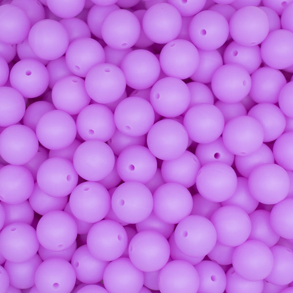 top view of a pile of 15mm Purple Glow In The Dark Silicone Bead