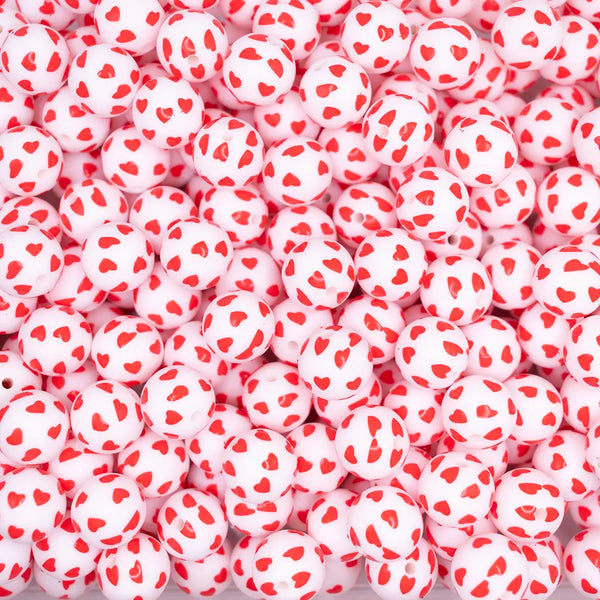 top view of a pile of 15mm Red Confetti Heart Print Silicone Bead