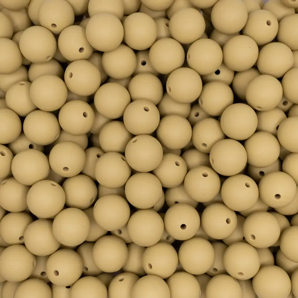 close up view of a pile of 15mm Sand Brown Round Silicone Bead