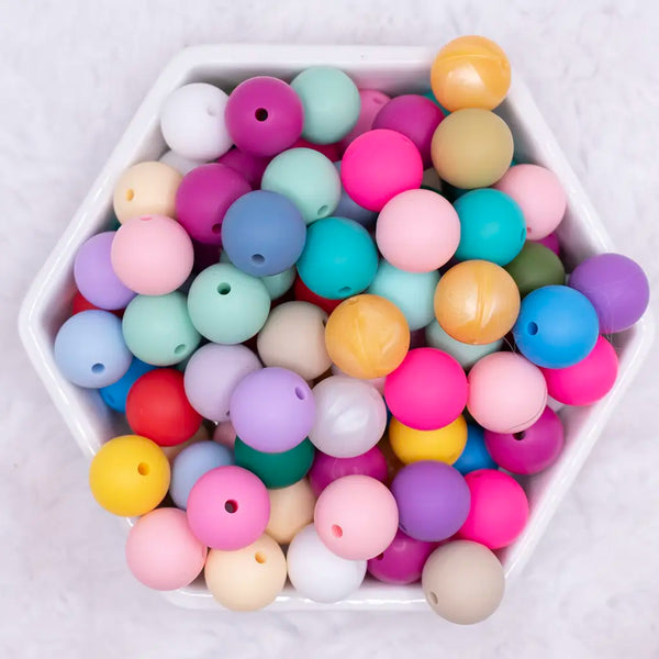 top view of a pile of 15mm Solid Color Mix Silicone Round Beads - 100 Count