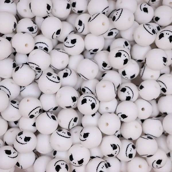 top view of a pile of 15mm Skeleton Face Silicone Bead