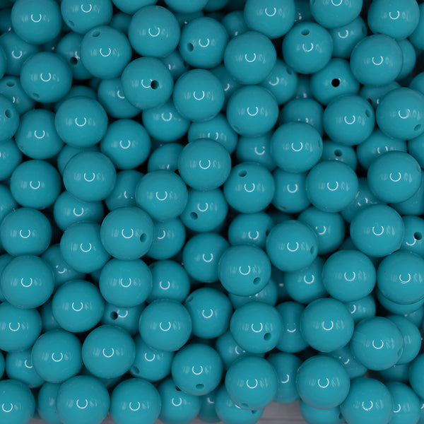 front view of a pile of 15mm Turquoise Liquid Style Silicone Bead