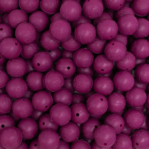 top view of a pile of 15mm Wine Red Embossed Floral Print Silicone Bead