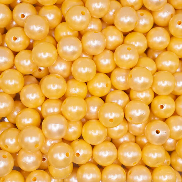 top view of a pile of 15mm Yellow Opal Shimmer Round Silicone Bead