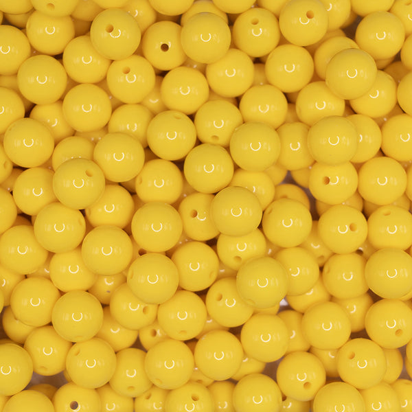 front view of a pile of 15mm Yellow Liquid Style Silicone Bead