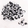 top view of a pile of 16mm Black,Gray And White Tablet Acrylic Bubblegum Beads