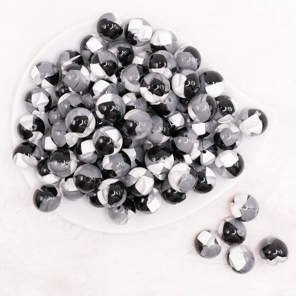 top view of a pile of 16mm Black,Gray And White Tablet Acrylic Bubblegum Beads