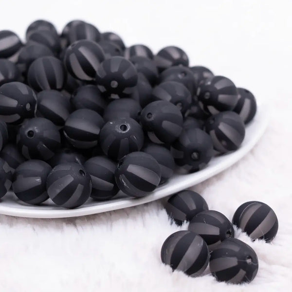 front view of a pile of 16MM Black Frosted Beach Ball Bubblegum Beads