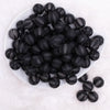 top view of a pile of 16MM Black Frosted Beach Ball Bubblegum Beads