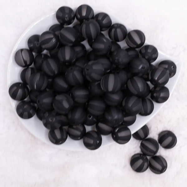 top view of a pile of 16MM Black Frosted Beach Ball Bubblegum Beads